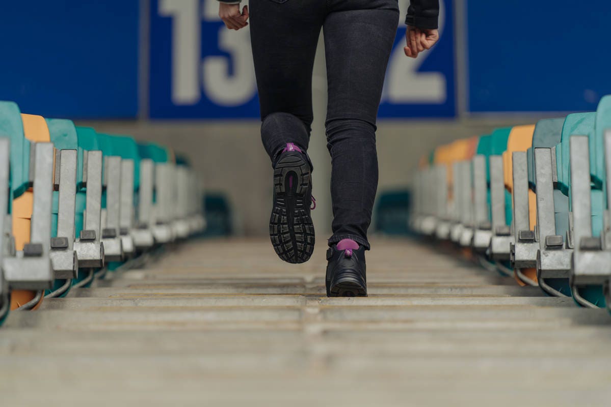 Photo of a person climbing stairs in Blundstone 887 women's safety boots